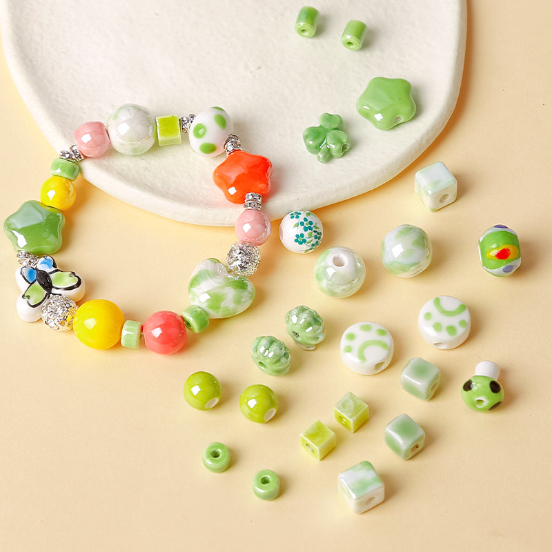 Al por mayor 30 piezas de cerámica verde fresca Cerámica encantadora Butterfly Heart Beads